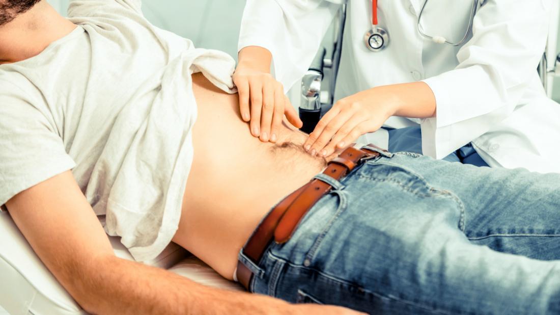 a-gastroenterologists-feeling-a-persons-stomach